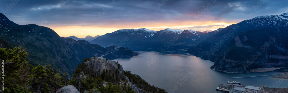 Scenic Panoramic Landscape view of the Beautiful Canadian Nature from the top of the Mountain during a colorful sunset. Taken in Squamish, North of Vancouver, BC, Canada. Scenic Panoramic Landscape view of the Beautiful Canadian Nature from the top of the Mountain during a colorful sunset. Taken in Squamish, North of Vancouver, BC, Canada.