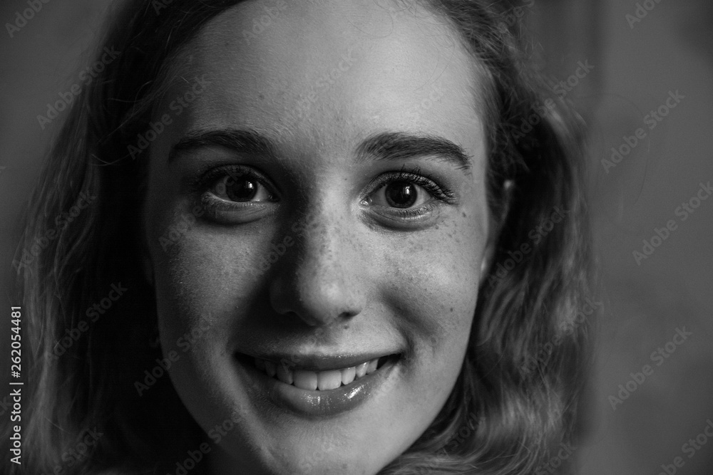 Portrait of a young smiling girl close-up.