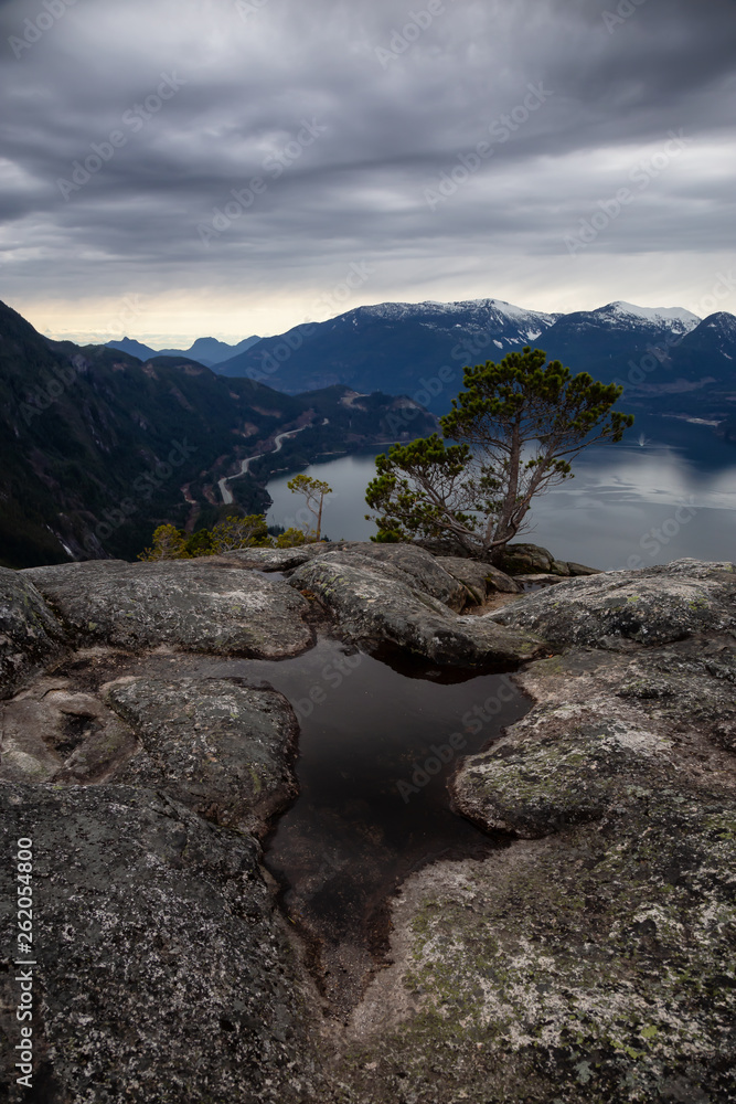 Scenic Landscape view from the top of the Mountain during  a cloudy day. Taken in Squamish, North of Vancouver, BC, Canada.