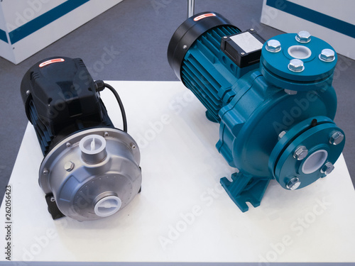 Obraz na plátne two electric motorized portable water pumps at hardware store