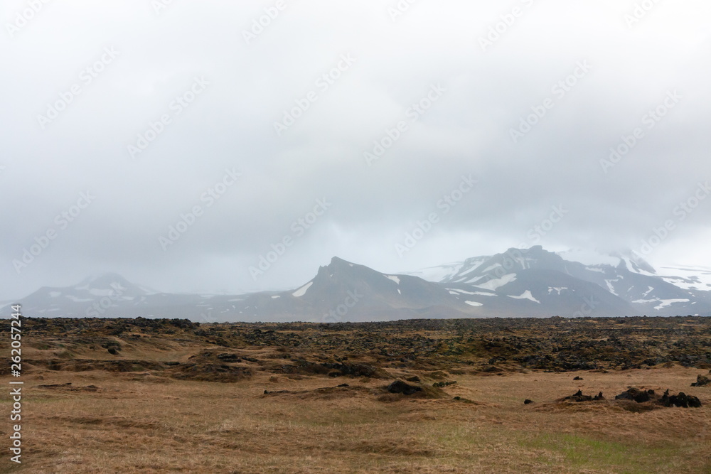 landscape with mountains, horizon line and increased cloud - Iceland
