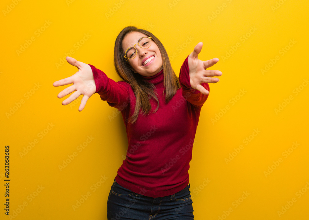 Young intellectual woman very happy giving a hug to the front Young intellectual woman very happy giving a hug to the front