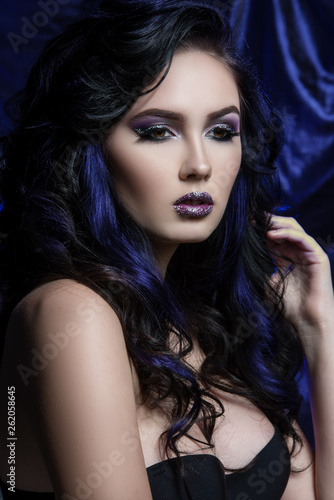 Gorgeous brunette with make up and hairstyle
