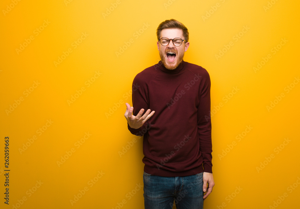 Young smart man very scared and afraid Young smart man very scared and afraid