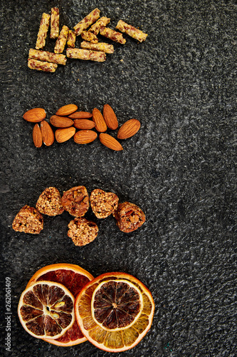 Healthy snacks - variety oat granola bar, rice crips, almond, dried orange