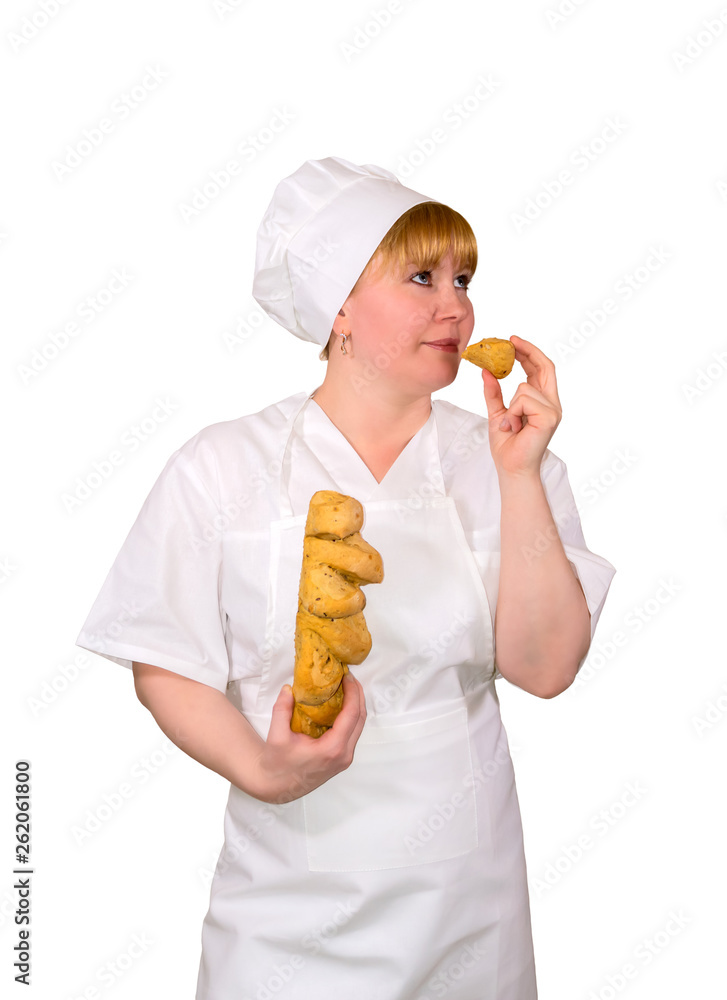 woman baker checks the quality of the loaf woman baker checks the quality of the loaf