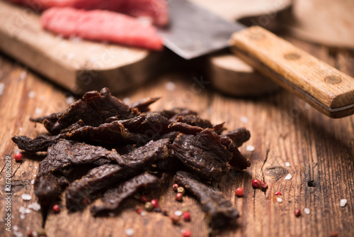 Картината върху платно Beef Jerky on  wooden background
