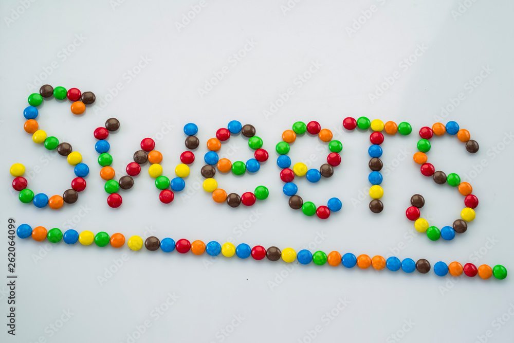 the word Sweet is made of round candies the word Sweet is made of round candies