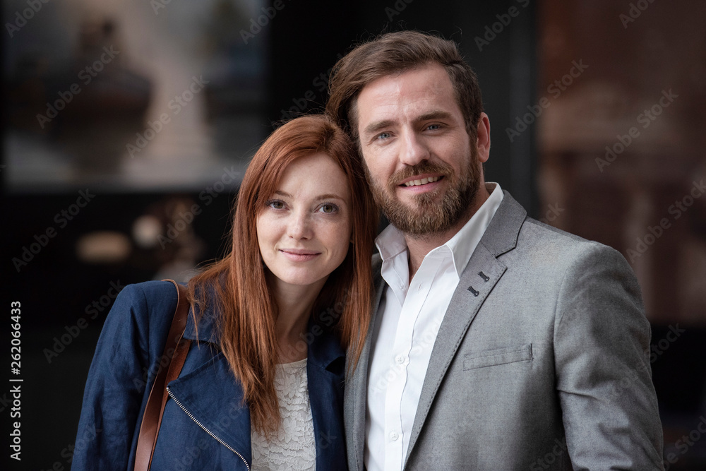 Portrait of smiling businessman and businesswoman standing in hotel Portrait of smiling businessman and businesswoman standing in hotel