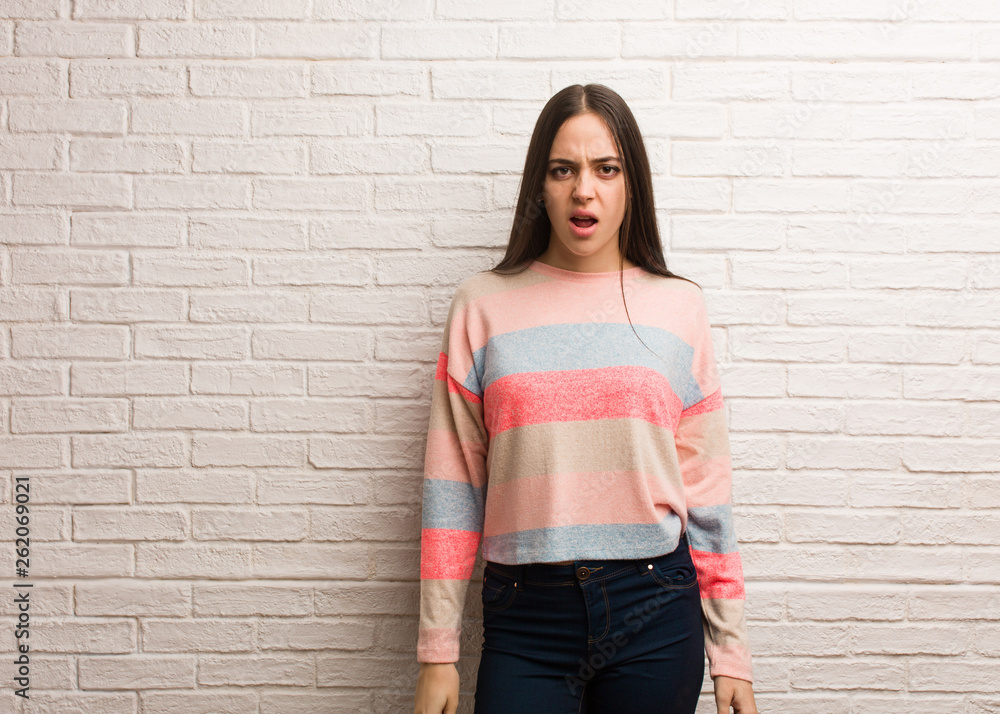 Young modern woman screaming very angry and aggressive Young modern woman screaming very angry and aggressive