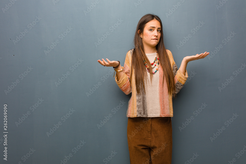 Young hippie woman confused and doubtful Young hippie woman confused and doubtful