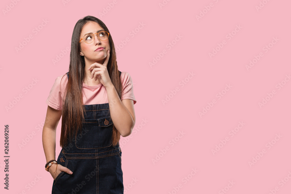 Young cool woman doubting and confused Young cool woman doubting and confused