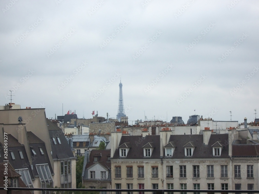 Grey sky over the roofs of Paris on a cloudy spring day due to fire in Notre Dame Cathedral