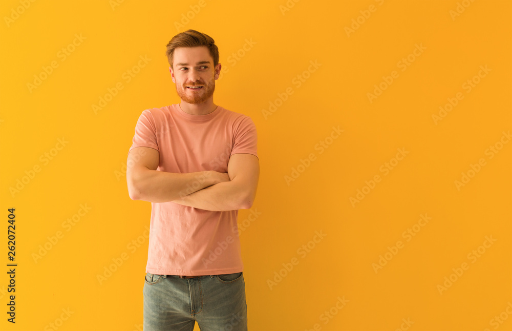 Young redhead man smiling confident and crossing arms, looking up Young redhead man smiling confident and crossing arms, looking up