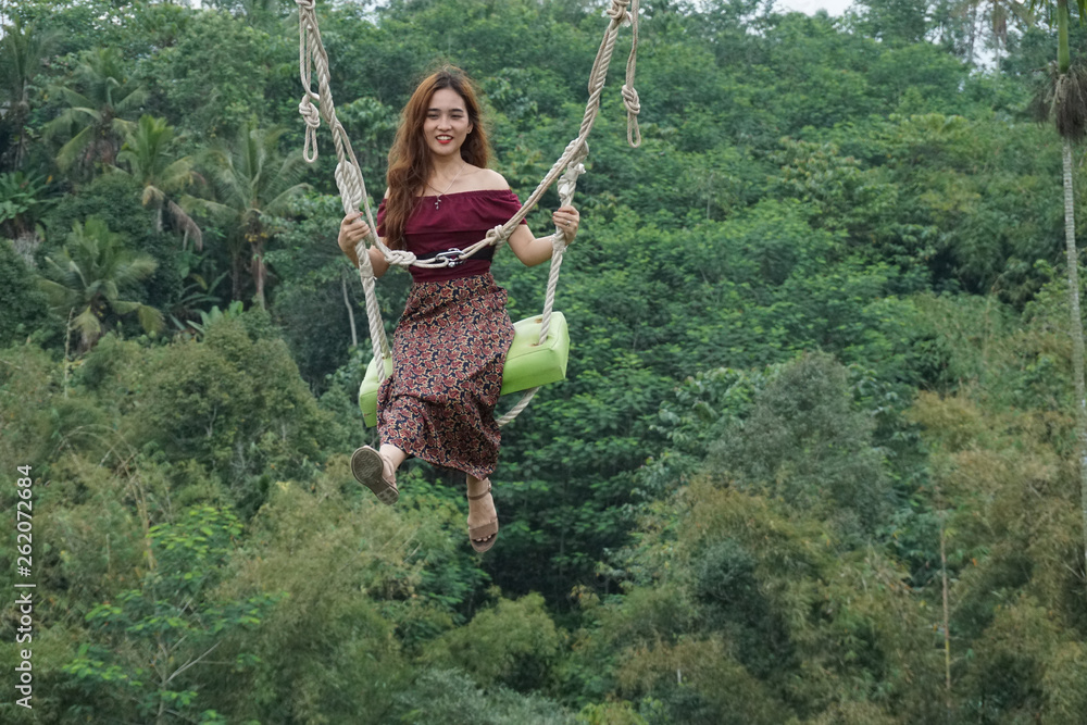 beauty woman in a swing bali indonesia