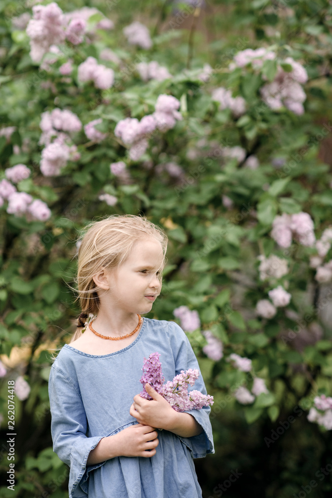 Portrait of smiling girl with lilac blossoms Portrait of smiling girl with lilac blossoms