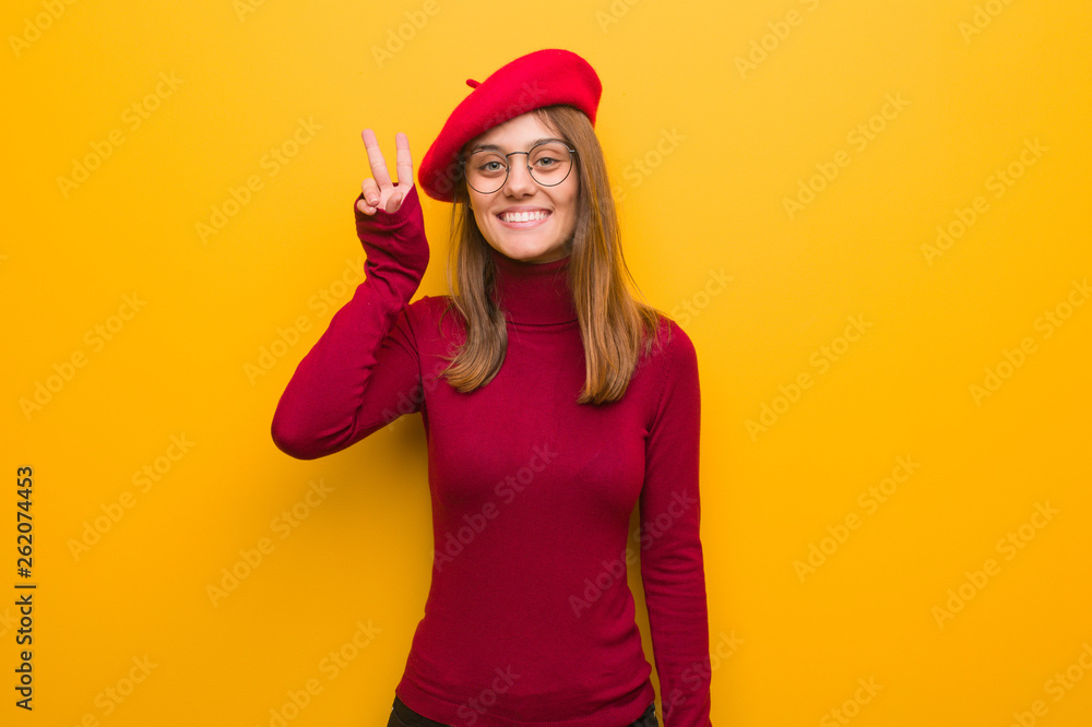 Young french artist woman fun and happy doing a gesture of victory Young french artist woman fun and happy doing a gesture of victory