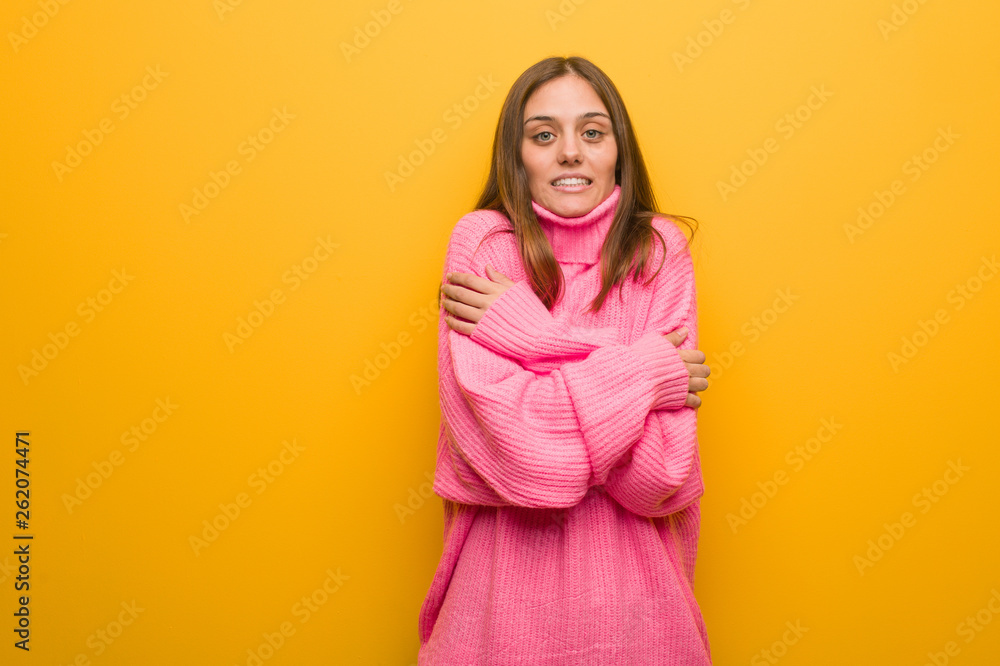 Young modern woman going cold due to low temperature Young modern woman going cold due to low temperature