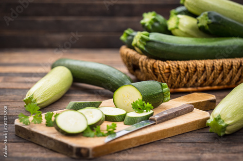 Fresh organic zucchini on the wooden table