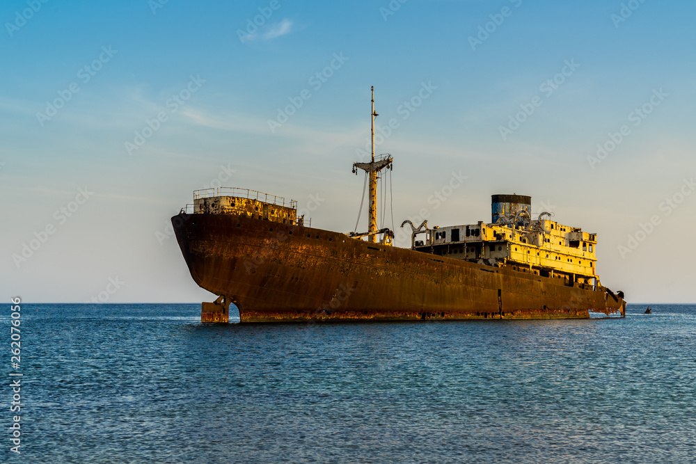 Spain, Lanzarote, Temple hall freightliner ship wreck rusty and decomposed in arrecife bay