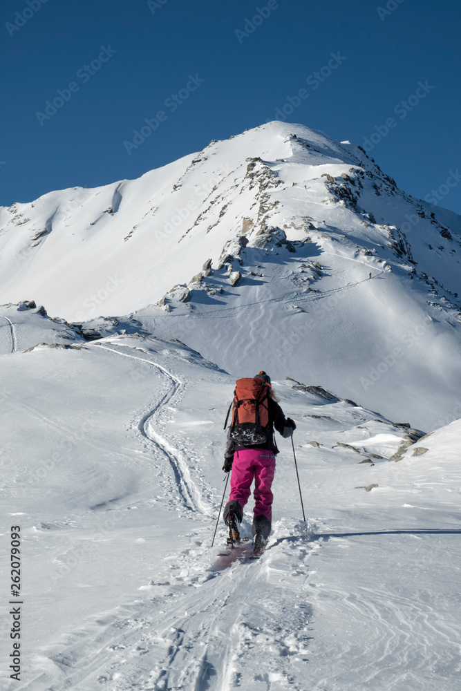 Switzerland, Bagnes, Cabane Marcel Brunet, Mont Rogneux, woman ski touring in the mountains Switzerland, Bagnes, Cabane Marcel Brunet, Mont Rogneux, woman ski touring in the mountains