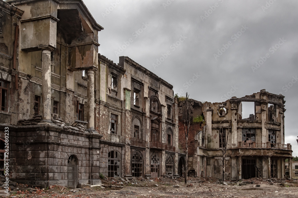 Post-war landscape. Destroyed building. War ruins. Destroyed city after the bombing. Dead city. Bombed buildings. Debris buildings. War destruction.