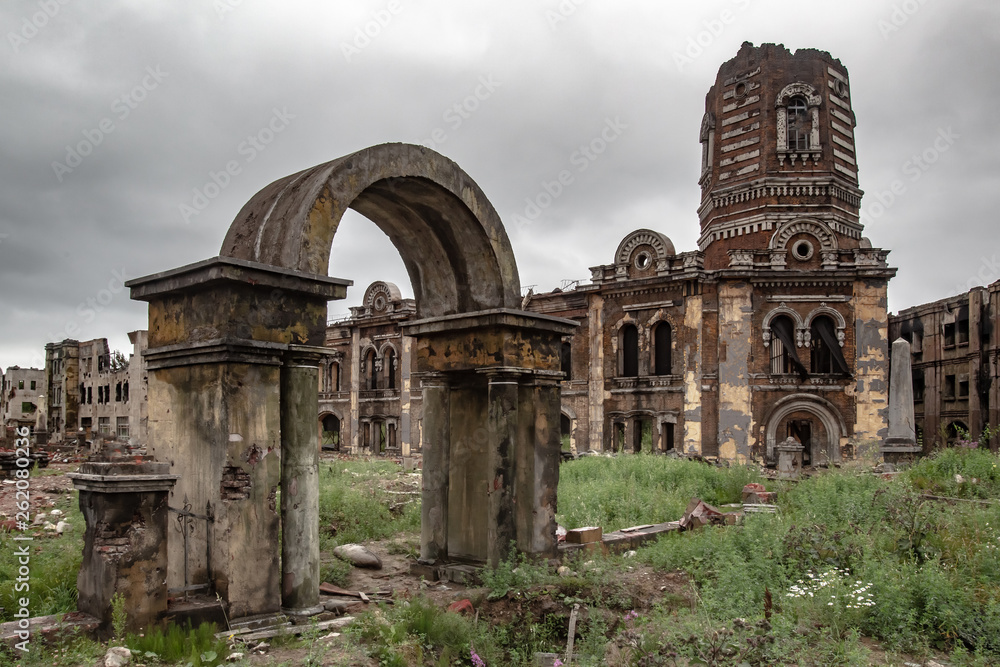 Post-war landscape. Abandoned city after the war. War ruins. Destroyed city after bomb attack. Dead city. Bombed buildings. Debris buildings. War destruction.