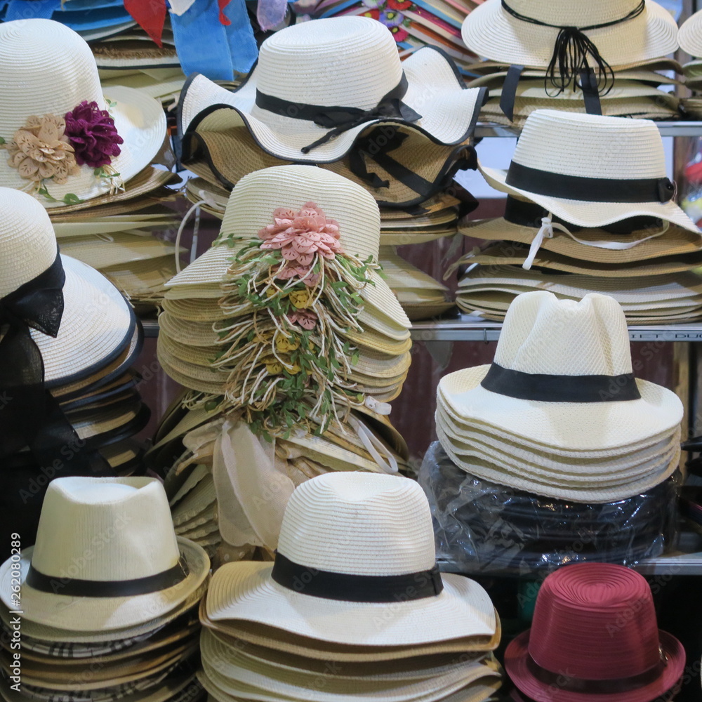 many straw hats handmade on a market in Vietnam