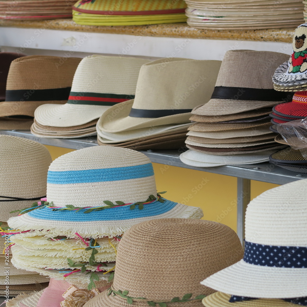 many straw hats handmade on a market in Vietnam