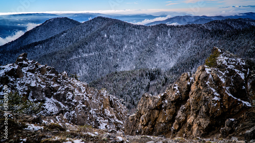Misty white clouds forming on top of a rocky mountain / yenice forest in karabuk turkey	
