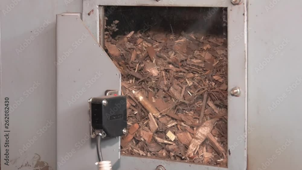 Modern models of water heaters, working on wood waste. Viewing window ...