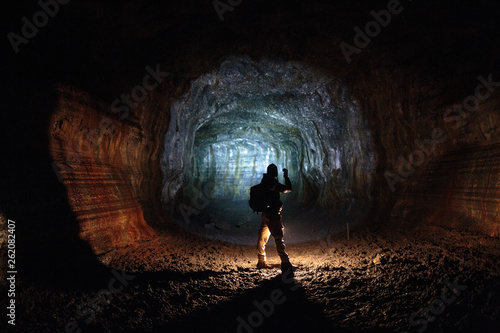 Man in Ape Cave at Gifford Pinchot National Forest, USA photo