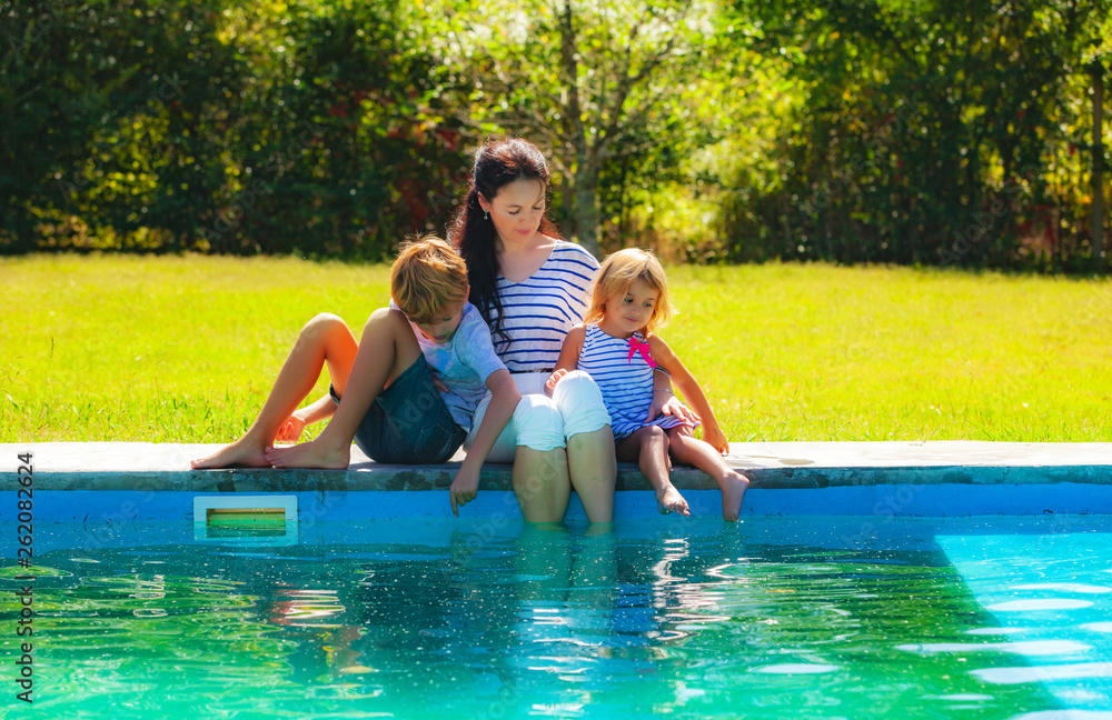 Fototapeta premium family by the pool