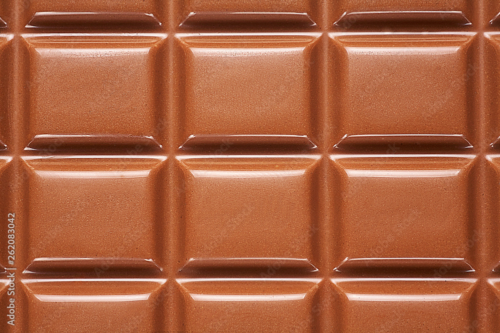 Naklejka premium Background from a chocolate bar close up.