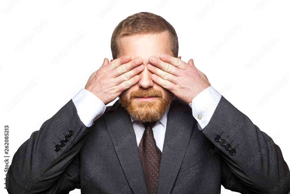 Closeup portrait of handsome businessman with facial beard in black suit standing and closed his eyes and dont want to looking. indoor studio shot isolated on white background. Closeup portrait of handsome businessman with facial beard in black suit standing and closed his eyes and dont want to looking. indoor studio shot isolated on white background.