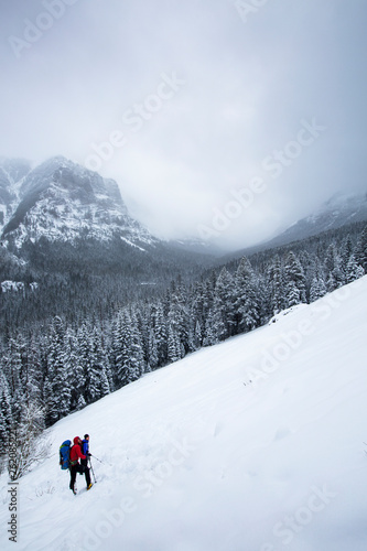 Ice climbers descend into Hyalite Canyon on a cloudy winter day in Montana. photo