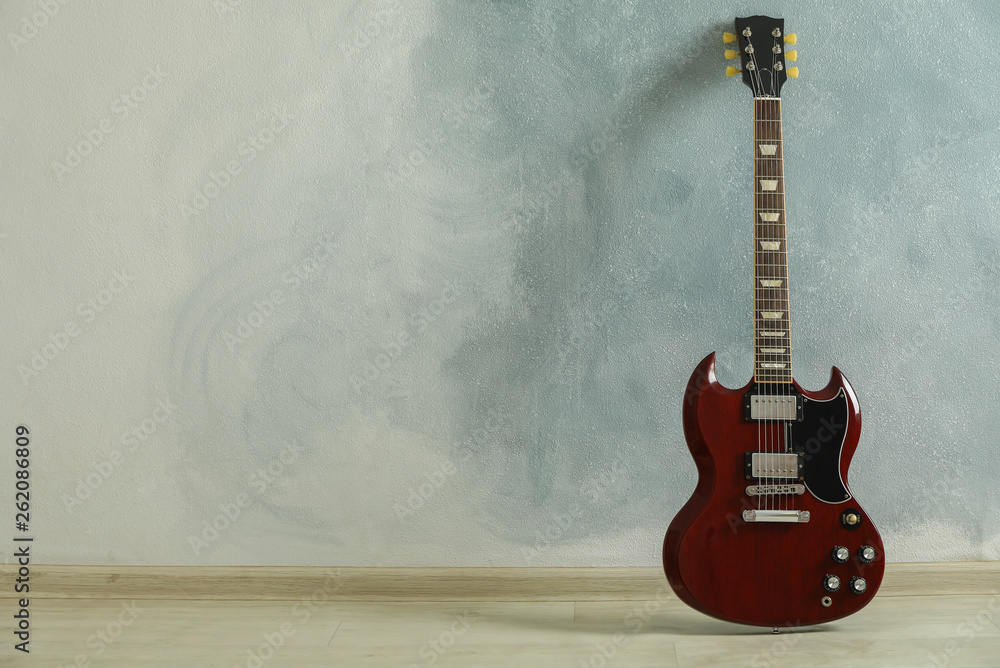 Beautiful six - string classic guitar against light background, space for text