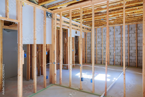New residential construction home framing with basement view