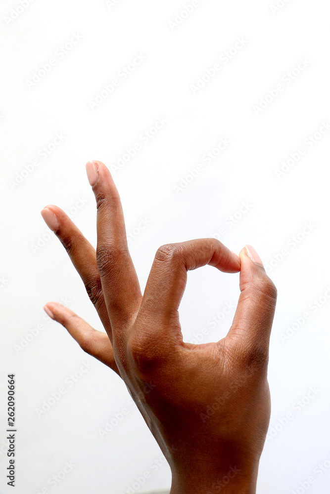 black african female hand gesturing on an isolated white background - pointing, ok sign, thumbs up, offensive gesture, open hand black african female hand gesturing on an isolated white background - pointing, ok sign, thumbs up, offensive gesture, open hand
