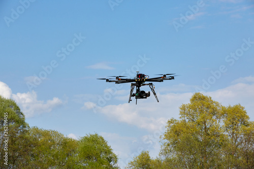 Octocopter flight over the forest. unmanned aerial vehicle. photographing from the air.