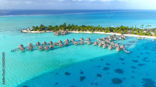 Tableau sur toile DRONE: Stunning view of the wooden overwater villas above the turquoise sea