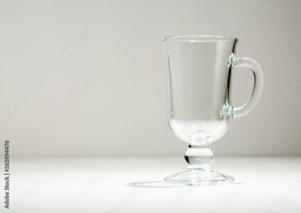 Glass empty glass or cup for mulled wine. Light background. Plenty of room for text.