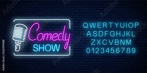 Neon sign of comedy show with retro microphone symbol with alphabet. Humor monolog stand up glowing signboard.