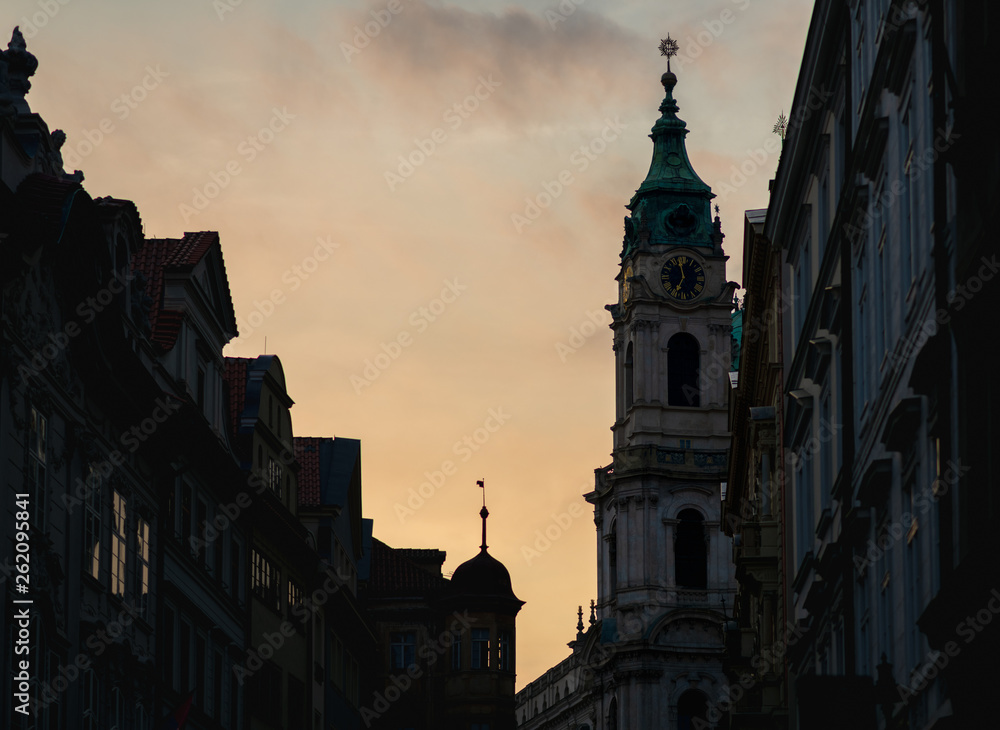 St. Nicholas Church in Prague during sunset in Spring 2019 - Showing the fine detail of the clock and decoration