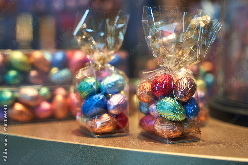 Traditional colorful Easter chocolate eggs in a confectionery storefront in Brussels, Belgium
