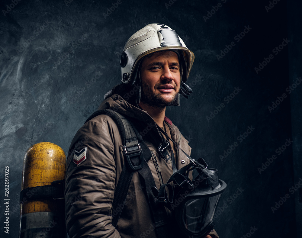 Smiling fireman with helmet and oxygen mask Smiling fireman with helmet and oxygen mask