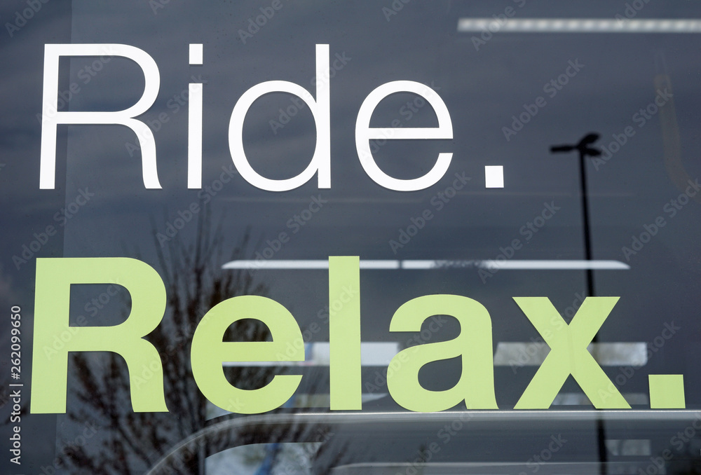 Ride and relax message on mass transit bus window Ride and relax message on mass transit bus window