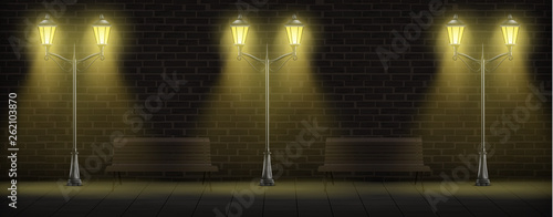 Streetlights on brick wall background with wooden benches. Luminous vintage street lights or lampposts on forged steel poles for urban design. Retro city lanterns. Realistic 3d vector illustration.