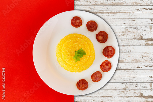 Dish with "cuscuz" on a wooden background, food from Brazilian Northeast. Top view - image