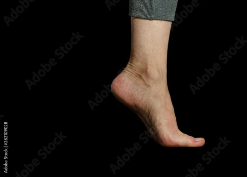 human foot on monochrome background